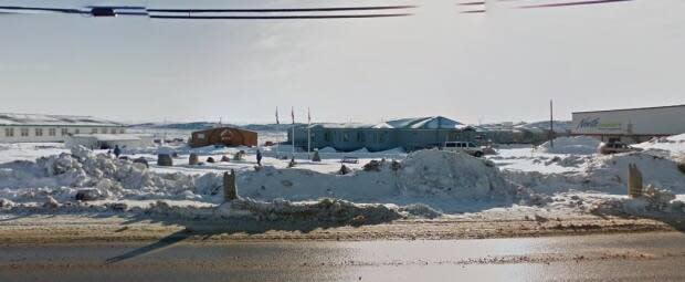 The Iqaluit Elders' Home, seen here directly to the left of the North Mart store, is being closed after a staff exposure to COVID-19, says Nunavut's health department. (Google Maps - image credit)