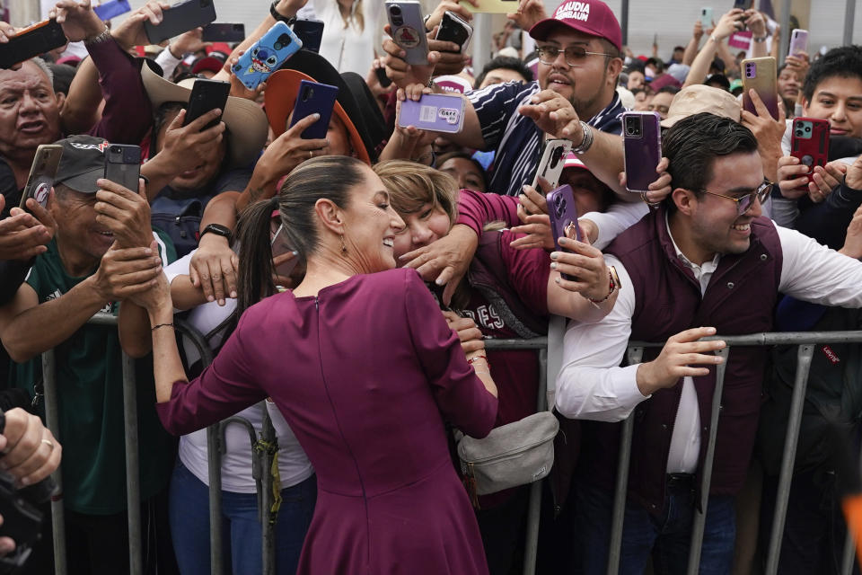 FILE - Ruling party presidential candidate Claudia Sheinbaum greets supporters upon her arrival to her opening campaign rally at the Zocalo in Mexico City, March 1, 2024. Mexican voters will go to the polls in the largest elections in the country’s history on June 2, 2024. In the presidential race, they will have to choose between three candidates, but two women have taken the lead: Sheinbaum and opposition candidate Xóchitl Gálvez. (AP Photo/Aurea Del Rosario, File)