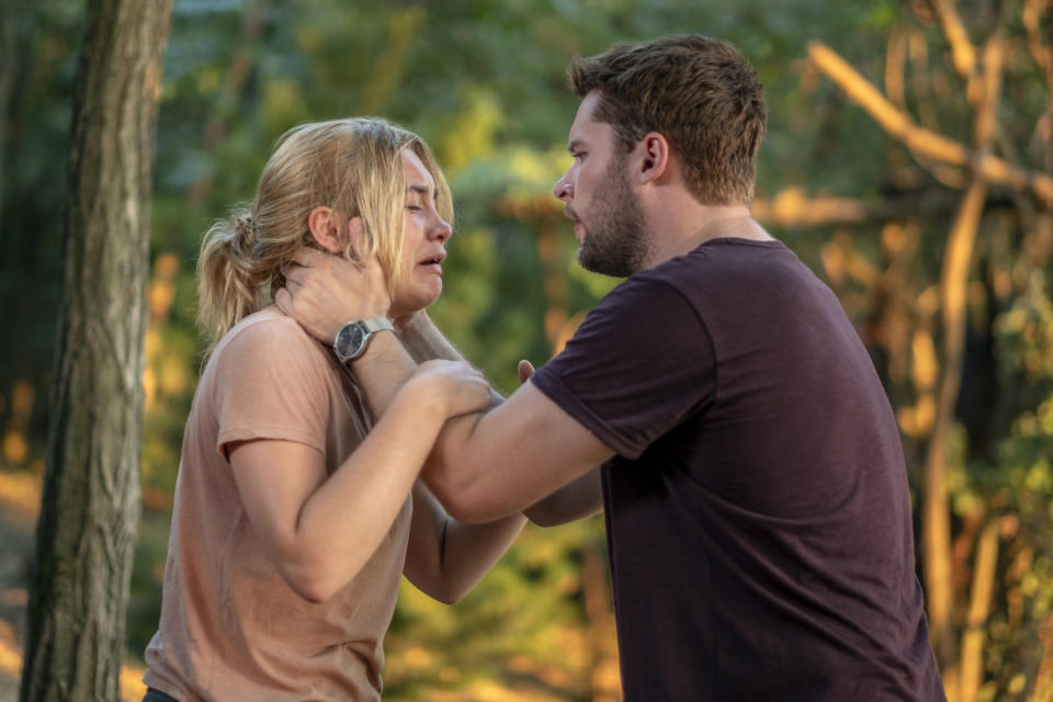 This image released by A24 shows Jack Reynor and Florence Pugh, left, in a scene from the horror film "Midsommar." (Gabor Kotschy/A24 via AP)