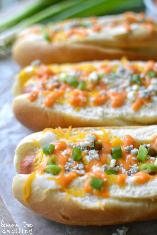 <p>Lemon Tree Dwelling</p><p>Spicy oven baked hot dogs, topped with ranch dressing, buffalo mayo, cheddar cheese, blue cheese, and sliced green onions. These franks are a perfect game day food to feed a crowd!</p><p><strong>Get the recipe: <a href="http://www.lemontreedwelling.com/2014/11/buffalo-hot-dogs.html" rel="nofollow noopener" target="_blank" data-ylk="slk:Buffalo Hot Dogs;elm:context_link;itc:0;sec:content-canvas" class="link rapid-noclick-resp">Buffalo Hot Dogs</a></strong></p>