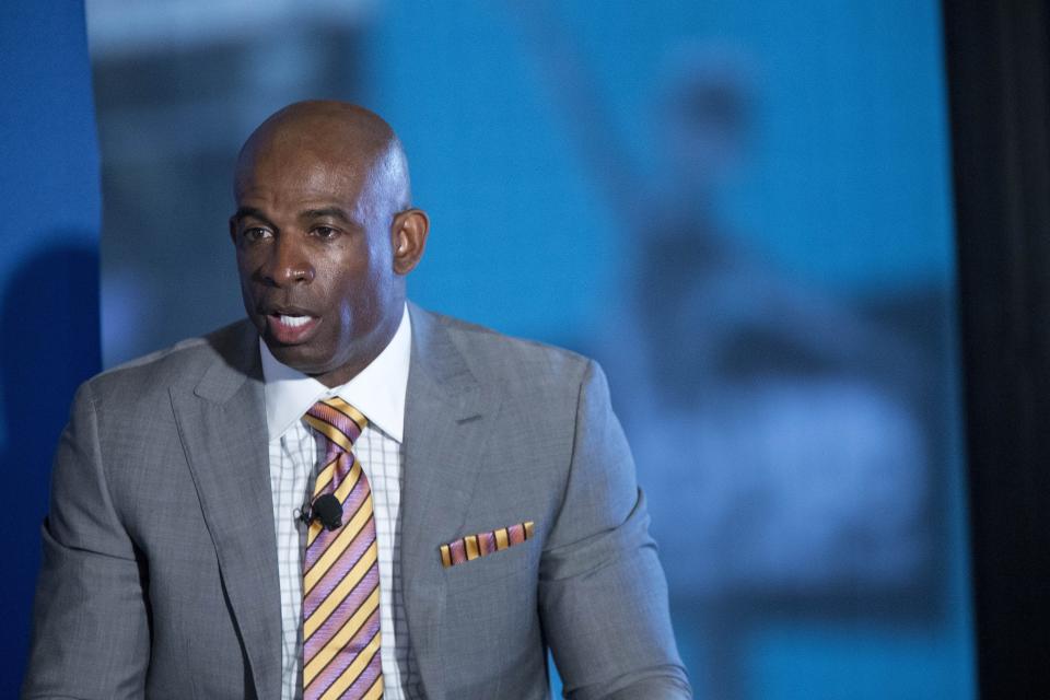 Deion Sanders speaks.