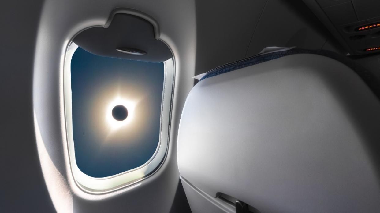  A total solar eclipse seen through an airline window. 
