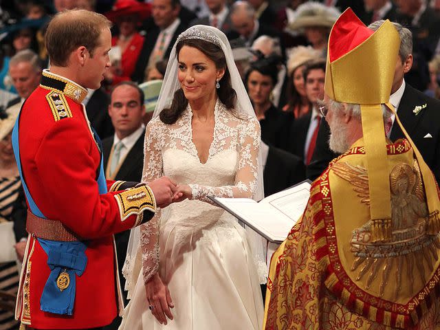 <p>Dominic Lipinski - WPA Pool/Getty</p> Prince William exchanges rings with his bride Catherine Middleton in front of the Archbishop of Canterbury Rowan Williams inside Westminster Abbey on April 29, 2011 in London, England.