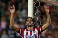 Atletico Madrid's Raul Garcia celebrates scoring against Austria Vienna during their Champions League Group G soccer match at Vicente Calderon stadium in Madrid November 6, 2013. REUTERS/Susana Vera (SPAIN - Tags: SPORT SOCCER)