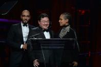 Alleged mastermind Low Taek Jho, (C) pictured with Swizz Beatz and Alicia Keys at a charity ball in 2014, remains at large