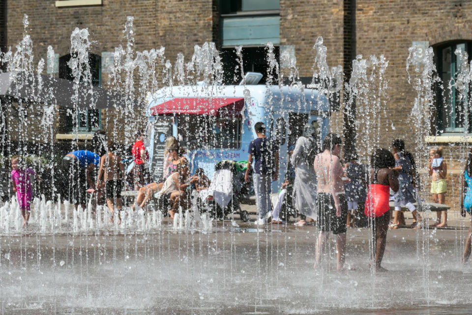 A sunny summer day with high temperatures during a heatwave in London, UK, on August 1, 2019. People including adults and children playing with the water in a dancing fountain at Granary Square, Kings Cross. In July 2019 London city and other cities in Europe had the highest ever measured temperature and the hottest day, a historical record high showing climate and weather change. (Photo by Nicolas Economou/NurPhoto via Getty Images)