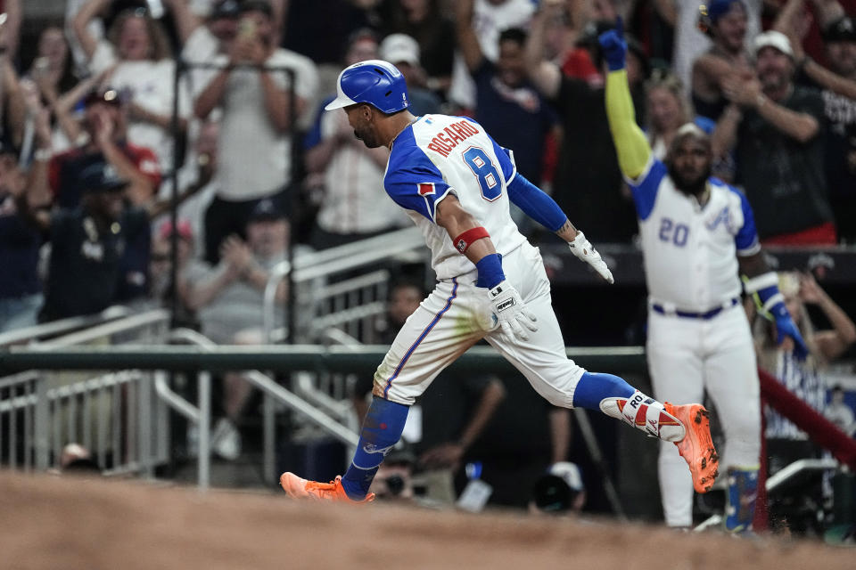 Atlanta Braves' Eddie Rosario runs the bases after hitting a two-run home run against the San Francisco Giants during the eighth inning of a baseball game Saturday, Aug. 19, 2023, in Atlanta. (AP Photo/John Bazemore)