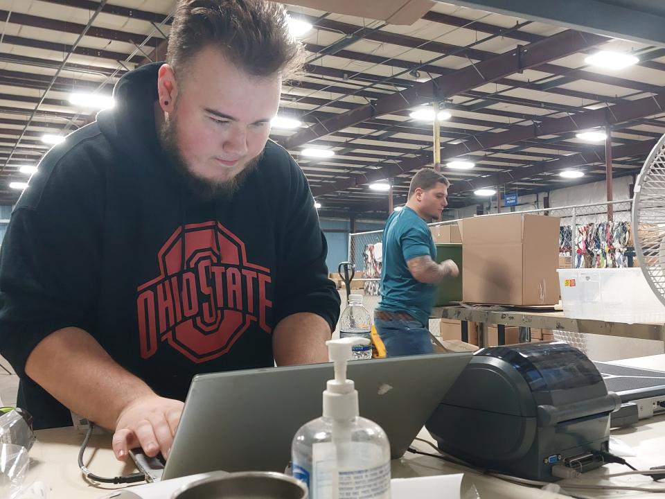 Pickaway-Ross Career and Technology Center Senior Evan Hice assists with shipping in Goodwill's eCommerce department at Goodwill's Chillicothe warehouse.