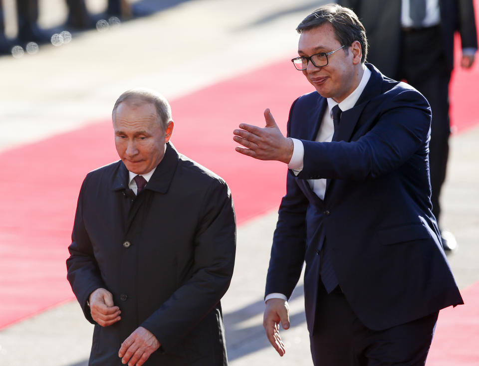 Serbian President Aleksandar Vucic, right, welcomes Russian President Vladimir Putin for the talks in Belgrade, Serbia, Thursday, Jan. 17, 2019. Putin arrives in Serbia on Thursday for his fourth visit to the Balkan country since 2001. (AP Photo/Darko Vojinovic)