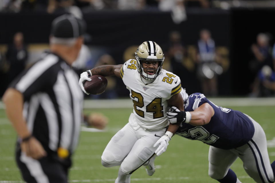 New Orleans Saints strong safety Vonn Bell (24) tries to return a fumble recovery against Dallas Cowboys offensive guard Connor Williams in the first half of an NFL football game in New Orleans, Sunday, Sept. 29, 2019. (AP Photo/Bill Feig)