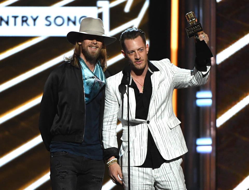 <p>Brian Kelley (L) and Tyler Hubbard of Florida Georgia Line accept Top Country Song for ‘H.O.L.Y.’ onstage during the 2017 Billboard Music Awards at T-Mobile Arena on May 21, 2017 in Las Vegas, Nevada. (Photo by Ethan Miller/Getty Images) </p>