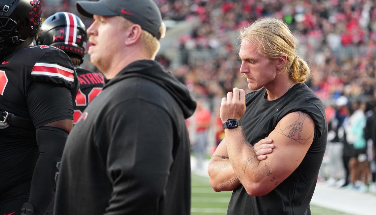 Former Ohio State player Harry Miller walks the field during warm ups before a game between the Ohio State Buckeyes and the Wisconsin Badgers at Ohio Stadium in September. Miller has opened up about his mental health challenges since he left the team.