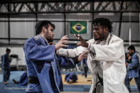 <p>Refugee judoka, Popole Misenga (R) , from the Democratic Republic of Congo, at the Universidad Estascio de Sa, in Rio de Janeiro, Brazil. He hopes to be selected as of the team of Refugee Olympic Athletes (ROA) created for the first time by the International Olympic Committee (IOC) as part of upcoming Olympics Games in Rio de Janeiro, Brazil. ; Popole Misenga was just nine years old when he fled fighting in Kisingani, in the Democratic Republic of the Congo. Separated from his family, he was rescued after eight days in the forest and taken to the capital, Kinshasa. There, at a centre for displaced children, he discovered judo. When you are a child, you need to have a family to give you instructions about what to do, and I didnt have one. Judo helped me by giving me serenity, discipline, commitment ?ñ everything. Popole became a professional judoka, but each time he lost a competition his coach locked him in a cage for days with only coffee and bread to eat. Finally, at the 2013 world championships in Rio, where he was deprived of food and knocked out in the first round, he decided to seek asylum. In my country, I didnt have a home, a family or children. The war there caused too much death and confusion, and I thought I could stay in Brazil to improve my life. After gaining refugee status, Popole began training with Flavio Canto, an Olympic bronze medallist. I want to be part of the Refugee Olympic Athletes team to keep dreaming, to give hope to all refugees and take sadness out of them, he says. I want to show that refugees can do important things. He also hopes to catch the attention of his relatives back home. I will win a medal, and will dedicate it to all refugees. </p>