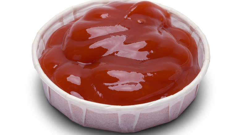 fast food paper ketchup cup with ketchup