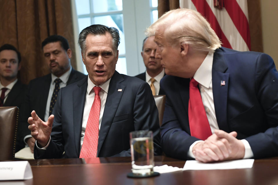 President Donald Trump, right, listens as Sen. Mitt Romney, R-Utah, third from left, speaks as they participate in a meeting in the Cabinet Room of the White House in Washington, Friday, Nov. 22, 2019, on youth vaping and the electronic cigarette epidemic. (AP Photo/Susan Walsh)