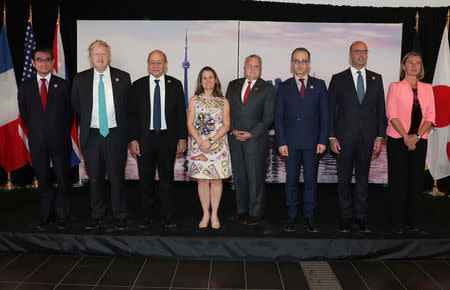 Canada's Minister of Foreign Affairs Chrystia Freeland is joined by France's Minister of Europe and Foreign Affairs Jean-Yves Le Drian, U.S. Acting Secretary of State John J. Sullivan, Britain's Foreign Secretary Boris Johnson, High Representative for the European Union's Foreign Affairs Federica Mogherini, Italy's Minister of Foreign Affairs Angelino Alfano, Japan's Minister of Foreign Affairs Taro Kono and Minister of Foreign Affairs for Germany Heiko Maas prior to a reception at the Royal Ontario Museum on the first day of the foreign ministers' meetings from G7 countries in Toronto, Ontario, Canada April 22, 2018. REUTERS/Fred Thornhill