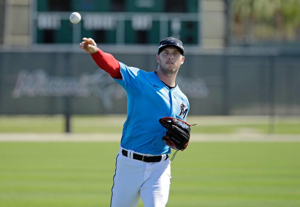 Miami Marlins outfielder Corey Dickerson (23) throws during the first full-squad spring training workout at Roger Dean Stadium on Monday, February 17, 2020 in Jupiter, FL.