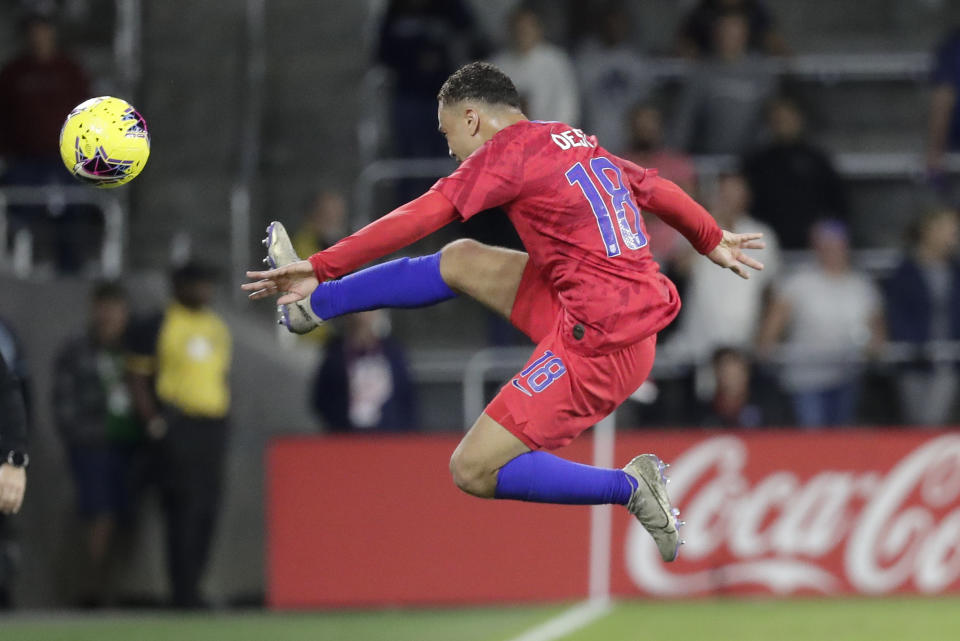 U.S. defender Sergino Dest tries to keep the ball from going out of bound during the second half of the team's CONCACAF Nations League soccer match against Canada on Friday, Nov. 15, 2019, in Orlando, Fla. (AP Photo/John Raoux)