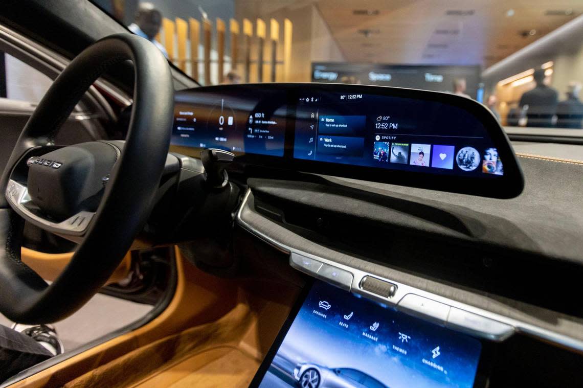 A close-up of the 34-inch glass cockpit in the driver cabin interior of a Lucid Air Grand Touring model at the Brickell Studio showroom for Lucid, a new high-end electric car company, within Brickell City Centre in Miami, Florida, on Friday, December 2, 2022.