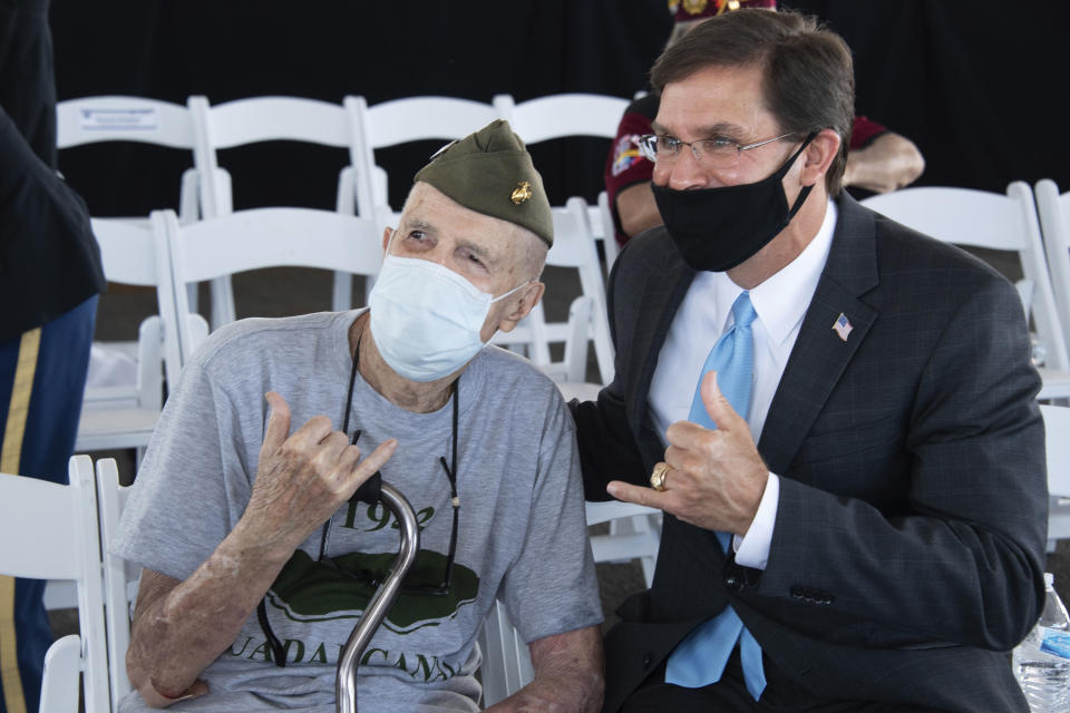 World War II U.S. Navy marine veteran Ted Richardson, 95, makes a shaka with U.S. Secretary of Defense Mark Esper aboard the USS Missouri, during the official ceremony for the 75th anniversary of the Japanese surrender that ended World War II in Honolulu, on Wednesday, Sept. 2, 2020. (Craig T. Kojima/Honolulu Star-Advertiser via AP, Pool)