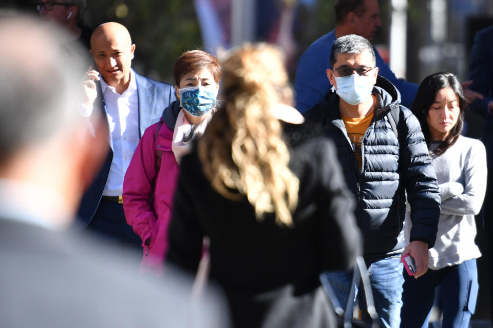 A small number of Sydneysiders wearing masks in the CBD in Sydney on Friday. Source: AAP