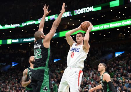 Feb 9, 2019; Boston, MA, USA; Los Angeles Clippers forward Danilo Gallinari (8) looks to make a pass while Boston Celtics center Al Horford (42) defends during the first half at TD Garden. Mandatory Credit: Bob DeChiara-USA TODAY Sports