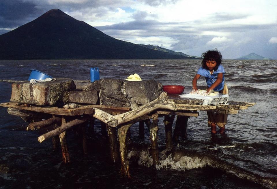 <div class="inline-image__caption"><p>A young woman washes clothes in Lake Managua, which borders the capital, Managua.</p></div> <div class="inline-image__credit">Courtesy Bill Gentile</div>