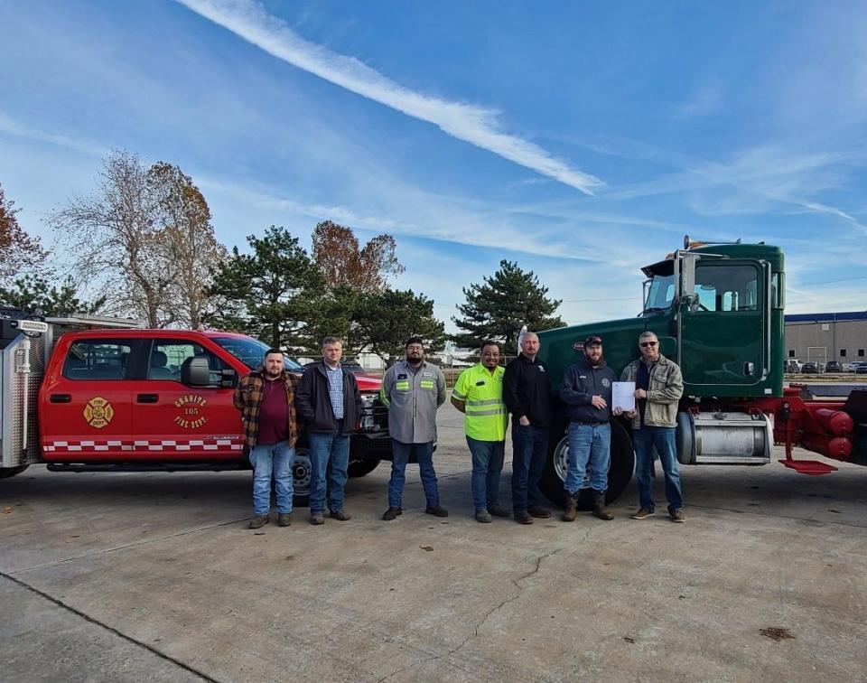 Starting from the left, Rafael Torres, fleet supervisor; Charles Crouse, maintenance supervisor; Jose Pimentel, mechanic; Felipe Flores, leadman; Brian Malatka, maintenance manager; Shawn Leckie, Granite VFD, and Scott Brewer, vice president concrete products division.