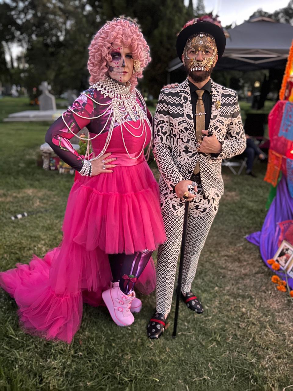 Melissa Hall and Rigel Anderson of Los Angeles display their looks at the Día de Los Muertos celebration at the Hollywood Forever Cemetery in Los Angeles on Saturday, Oct. 28, 2023.
