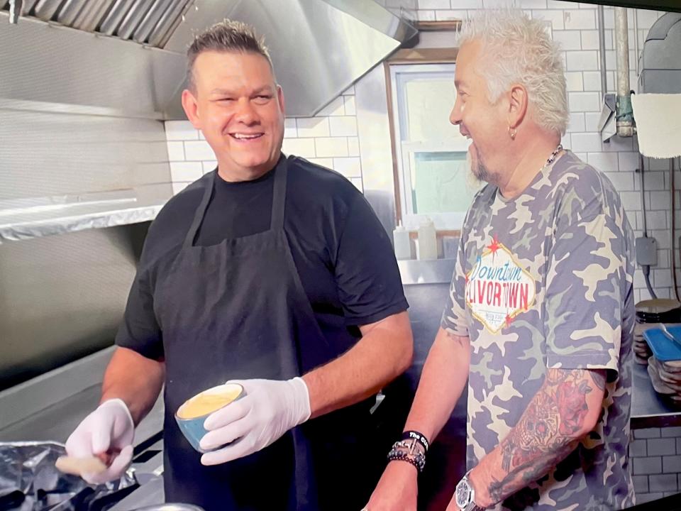 Guy Fieri alongside Third Wave Café chef David Moscoso on "Diners, Drive-Ins and Dives."