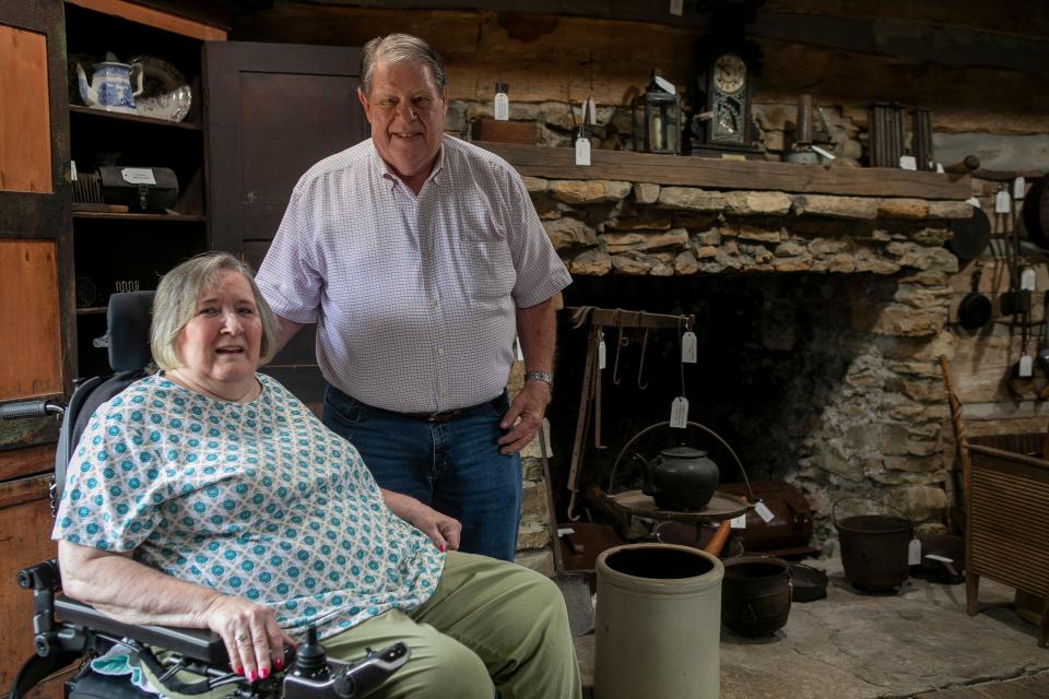 Lloyd and Diann Helber, of Lancaster, stand inside of the renovated Pioneer Log House at the Fairfield County Fairgrounds on September 25, 2023, in Lancaster, Ohio. The Helbers donated money to the through the Fairfield County Foundation to restore the log house.