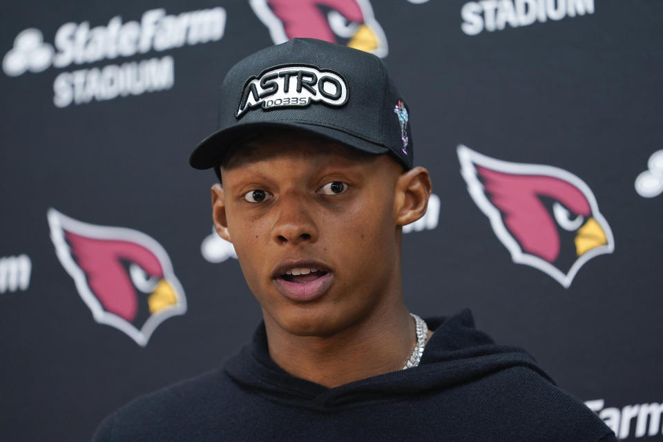 Arizona Cardinals quarterback Joshua Dobbs (9) speaking to members of the media at the end of an NFL football game against the Washington Commanders, Sunday, Sept. 10, 2023, in Landover, Md. Washington won 20-16. (AP Photo/Susan Walsh)