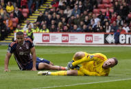 Nottingham Forest goalkeeper Matz Sels, right, gestures after a collision with his teammate Murillo, during the English Premier League soccer match between Sheffield United and Nottingham Forest, at Bramall Lane, in Sheffield, England, Saturday May 4, 2024. (Danny Lawson/PA via AP)