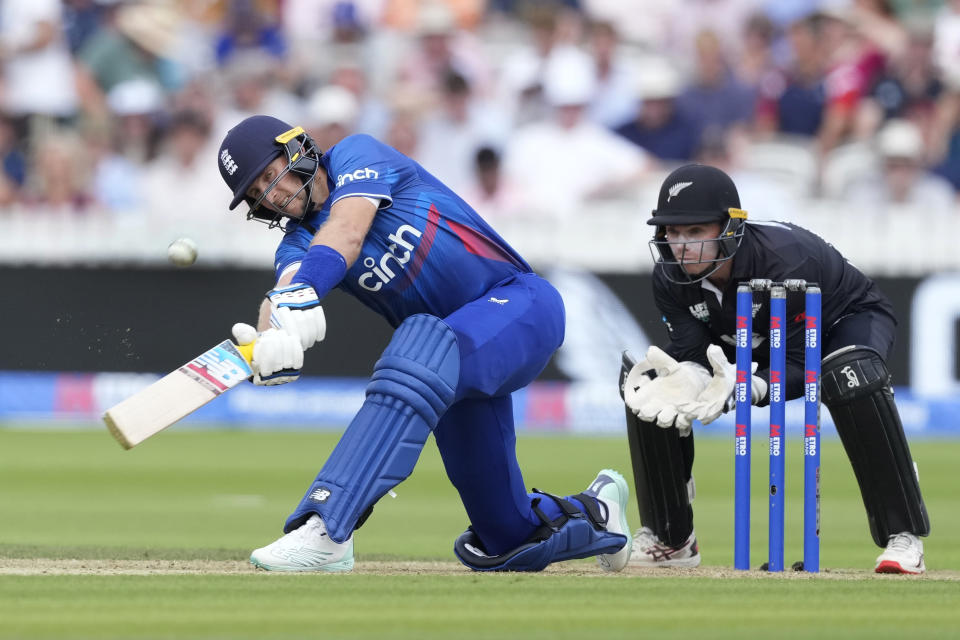 England's Joe Root plays a shot off the bowling of New Zealand's Rachin Ravindra during the One Day International cricket match between England and New Zealand at Lord's cricket ground in London, Friday, Sept. 15, 2023. (AP Photo/Kirsty Wigglesworth)