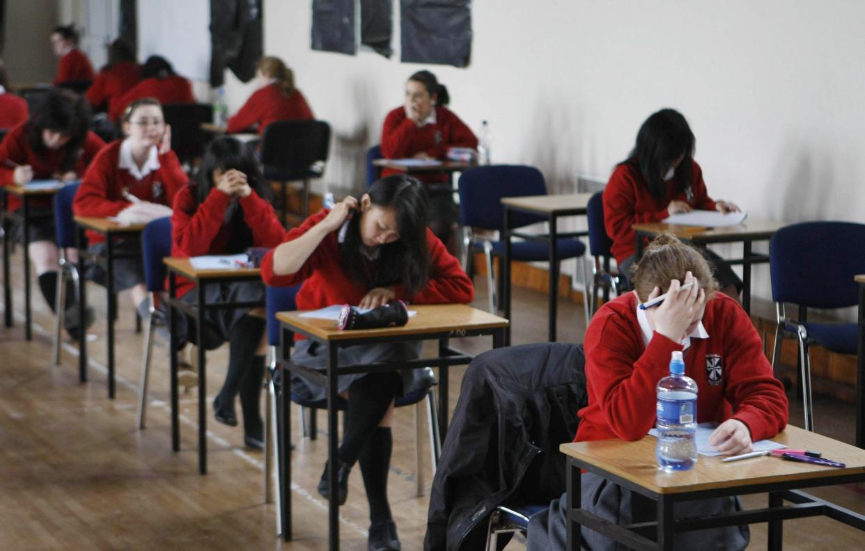 Undated file photo of students sitting an exam. The GCSE system should be overhauled, and pupils should have opportunities to demonstrate their skills up to the age of 19 rather than at a fixed point in time at the age of 16, a new report argues. Issue date: Wednesday February 2, 2022.