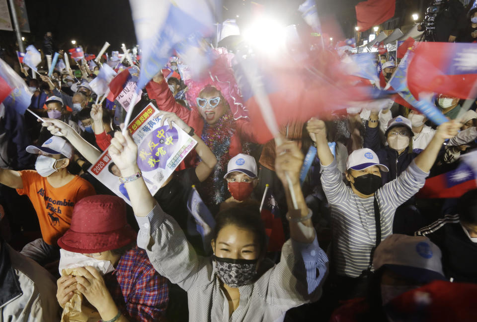 Supporters of Taiwan Kuomintang party Taipei city mayoral candidate Wayne Chiang cheer in Taipei, Taiwan, Saturday, Nov. 26, 2022. Lingering concerns about the threat posed by its giant neighbor China took a backseat in Taiwan''s closely watched local elections on Saturday as voters focused on other pressing issues closer to home such as air pollution and bad traffic. (AP Photo/Chiang Ying-ying)