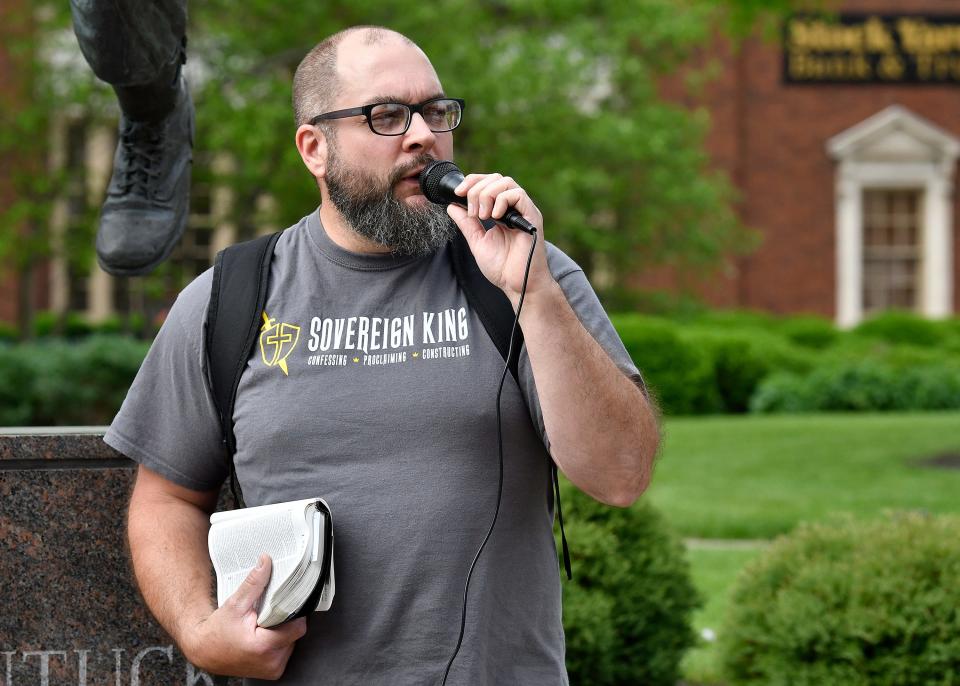 An anti-abortion activist talks to the crowd gathered for an abortion rights rally outside the Louisville Metro Hall, Wednesday, May. 4, 2022 in Louisville Ky.