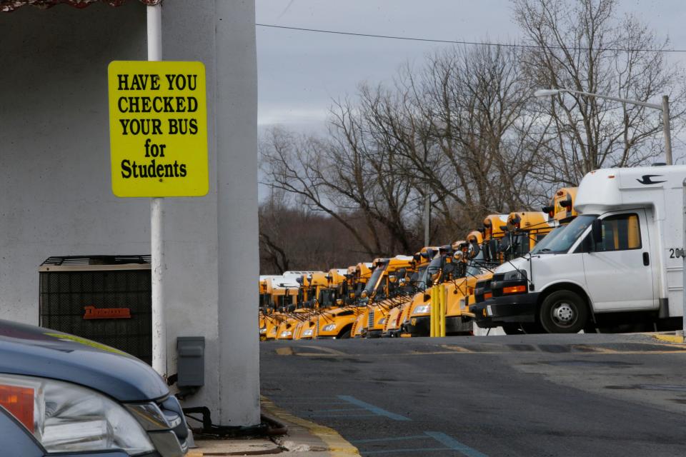 Red Clay School District buses sit in a bus yard in New Castle.