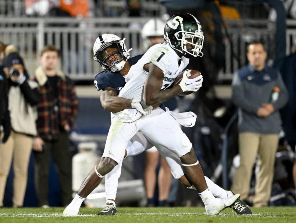 Penn State cornerback Johnny Dixon stops Michigan State’s Jaylen Reed during the game on Saturday, Nov. 26, 2022.