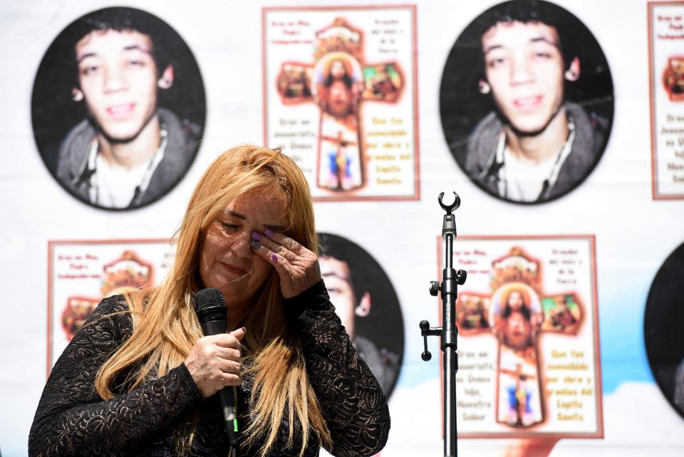 Cecilia Luna-Diaz, far right, wipes away a tear while speaking during a memorial ceremony for her son, Elvin Diaz on the second anniversary of his death at the Temple Ave. home in Hackensack where he was shot and killed by Hackensack police on May 21, 2105. The officers said Diaz was refused to put down a meat cleaver he was holding and moved toward the officers.