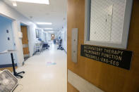 Unused equipment lines the hallway of the Alliance Healthcare System hospital in Holly Springs, Miss., as photographed Feb. 29, 2024. The medical facility was initially approved by the federal government as a rural emergency hospital in March 2023, requiring closing all inpatient beds and providing 24/7 emergency care. However, they have been denied the status and must now transition back to a full-service hospital. (AP Photo/Rogelio V. Solis)