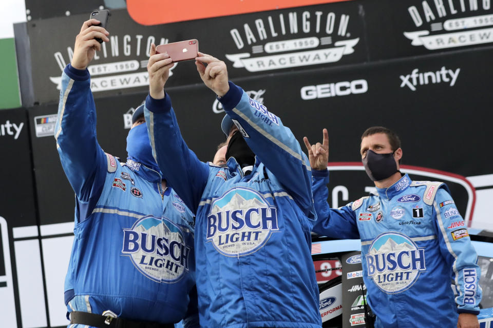 Members of Kevin Harvick's team celebrate after winning the NASCAR Cup Series auto race Sunday, May 17, 2020, in Darlington, S.C. (AP Photo/Brynn Anderson)