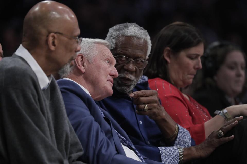 Lakers legend Jerry West chats with Celtics great Bill Russell alongside Kareem Abdul Jabbar.