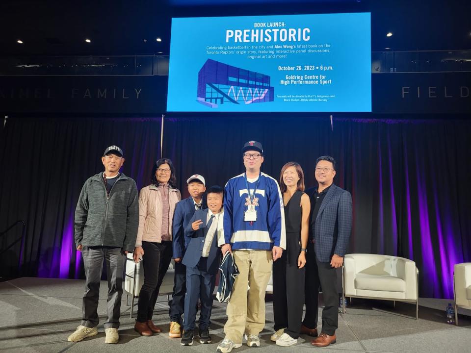 Alex Wong, centre, and his family celebrated the launch of his book, Prehistoric, the hisotry of the Toronto Raptors.