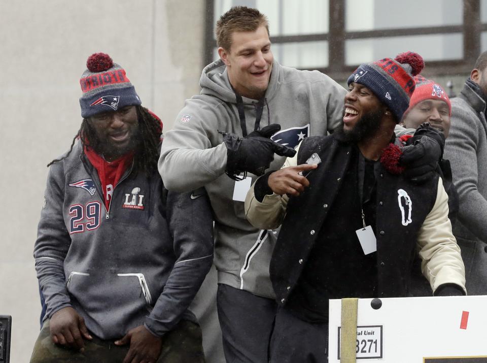 LeGarrette Blount, Rob Gronkowski and James White celebrate during the New England Patriots’ victory parade. (AP)