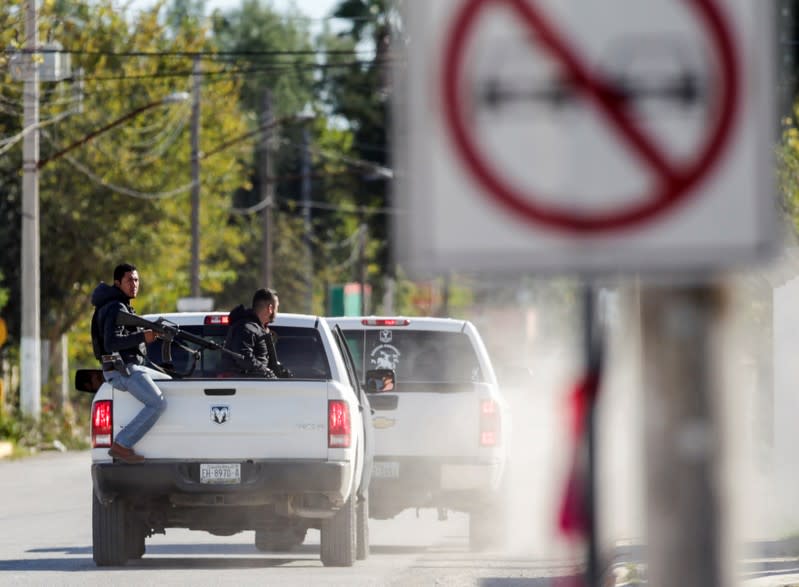 State police officers patrol the streets, days after a gun battle between police and hitmen, in the municipality of Villa Union, Coahuila