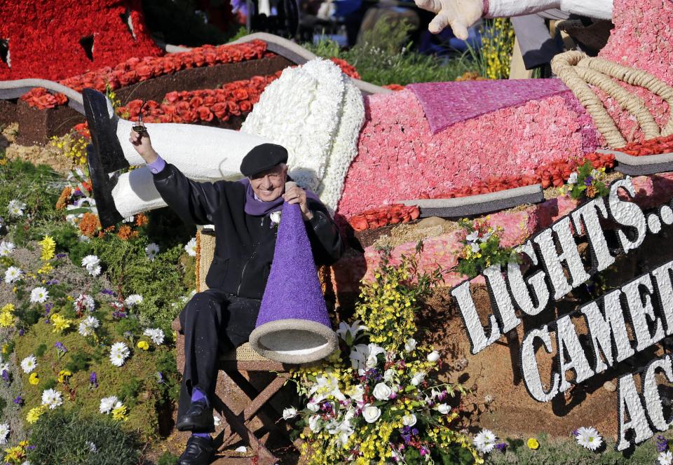 Producer and director Garry Marshall is seen aboard the City of Burbank, Calif., float, "Lights, Camera, Action," winner of the Fantasy award, on Colorado Boulevard in the 125th Rose Parade in Pasadena, Calif., Wednesday, Jan. 1, 2014. (AP Photo/Reed Saxon)