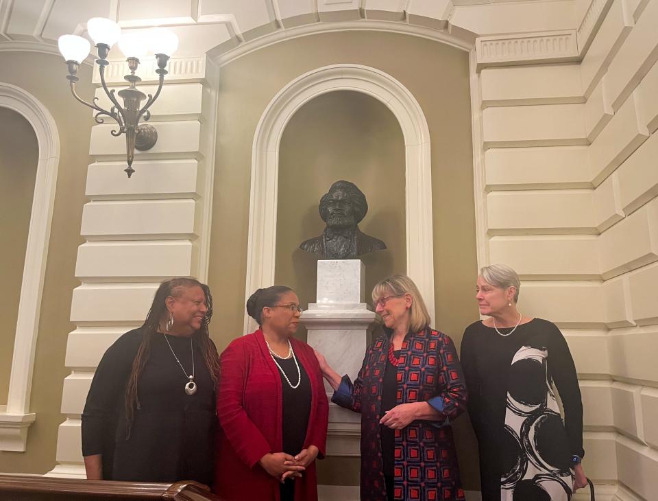 The state Senate unveiled a bust of Frederick Douglass in its chamber on Wednesday. Among those attending a ceremony marking the occasion were, from left, State House Art Commission member L'Merchie Frazier; Museum of African American History CEO Noelle Trent; state Senate President Karen Spilka; and Nina Lillie LeDoyt, daughter of the sculptor.