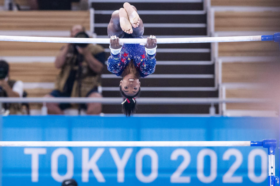 Simone spinning over the high bar