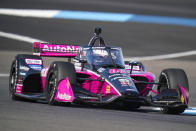 Helio Castroneves, of Brazil, drives during practice for the IndyCar auto race at Indianapolis Motor Speedway in Indianapolis, Friday, May 13, 2022. (AP Photo/Michael Conroy)